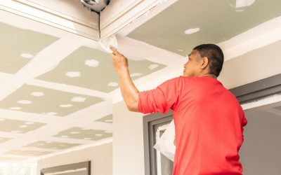 Construction worker are plastered a ceiling. Build a house conce Construction worker are plastered a ceiling. Build a house concept.