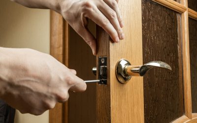 handyman fixing or repairing apartment wooden door lock. home furniture adjusting. door repair concept handyman fixing or repairing apartment wooden door lock. home furniture adjusting. door repair concept.